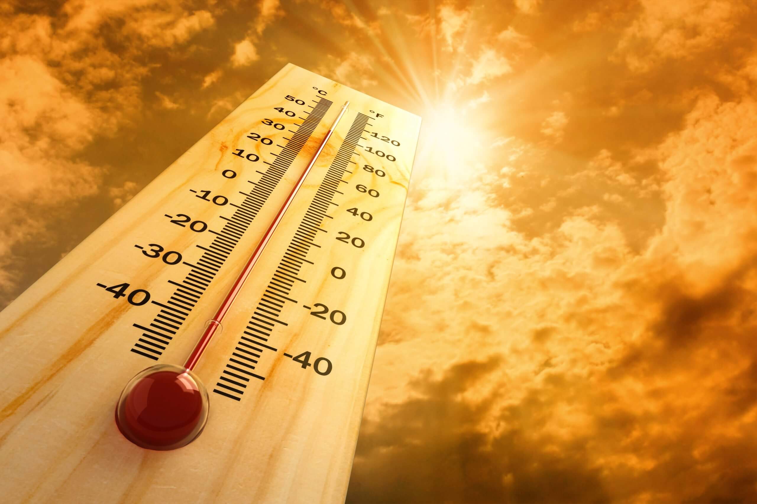 Thermometer places against a hot sky