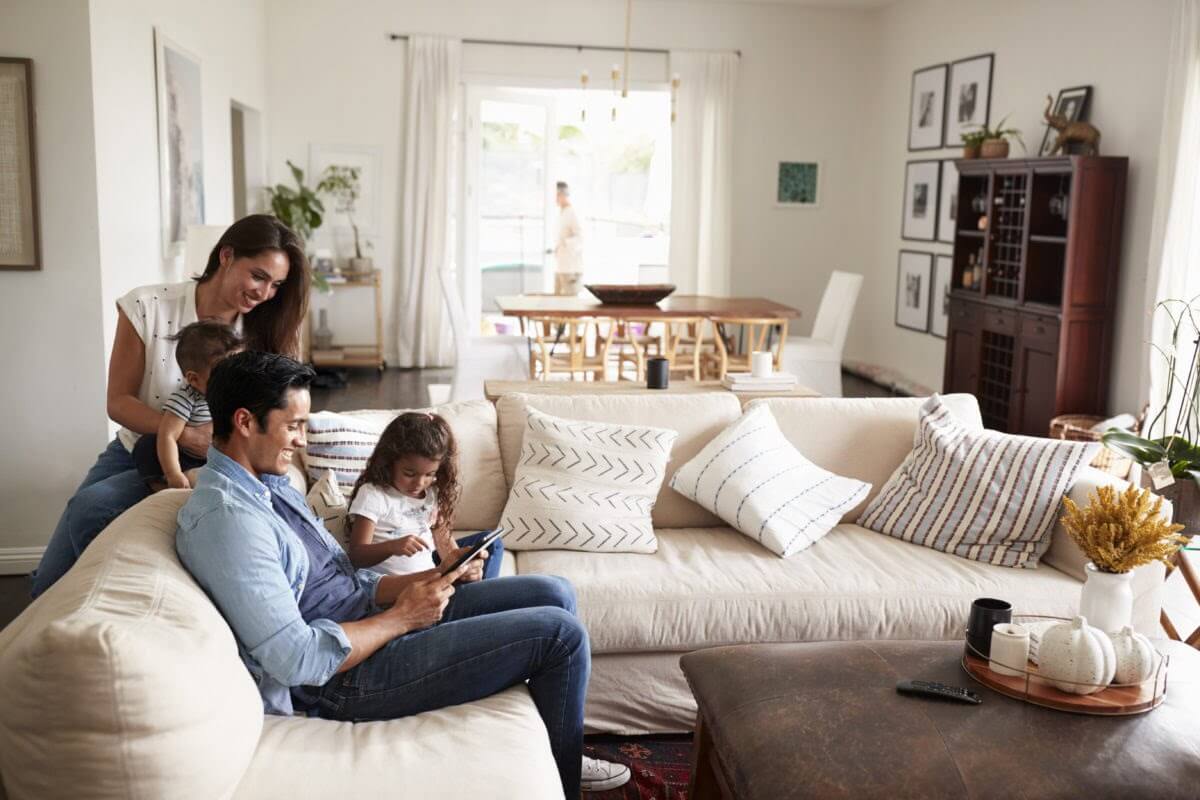 Young Hispanic family spending time in their living room