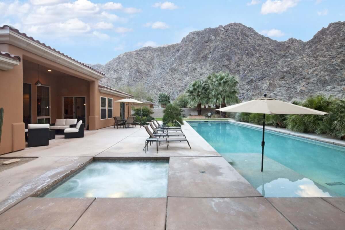 The backyard of a tucson rental home with a pool