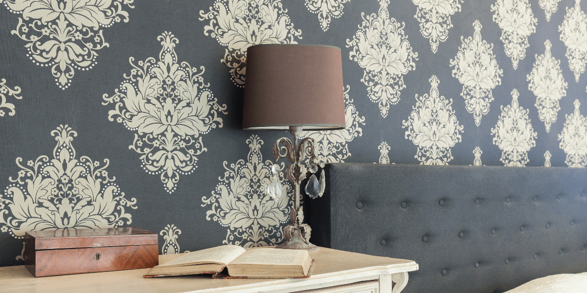 A bedroom wall with wallpaper | Home decorating mistakes