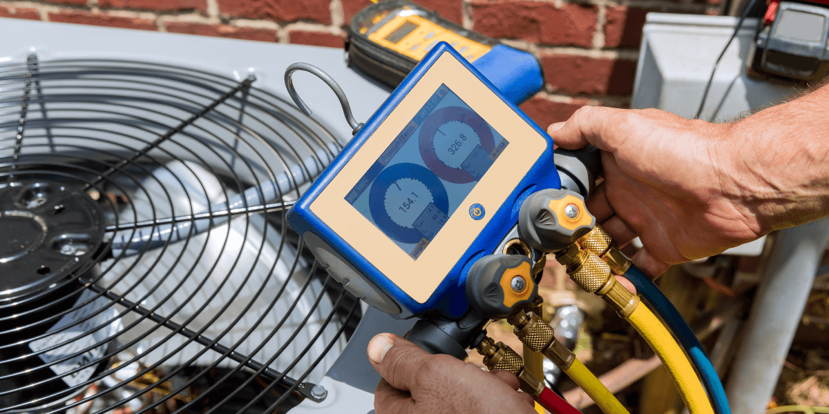Person working on air condition unit | Prep Your Property
