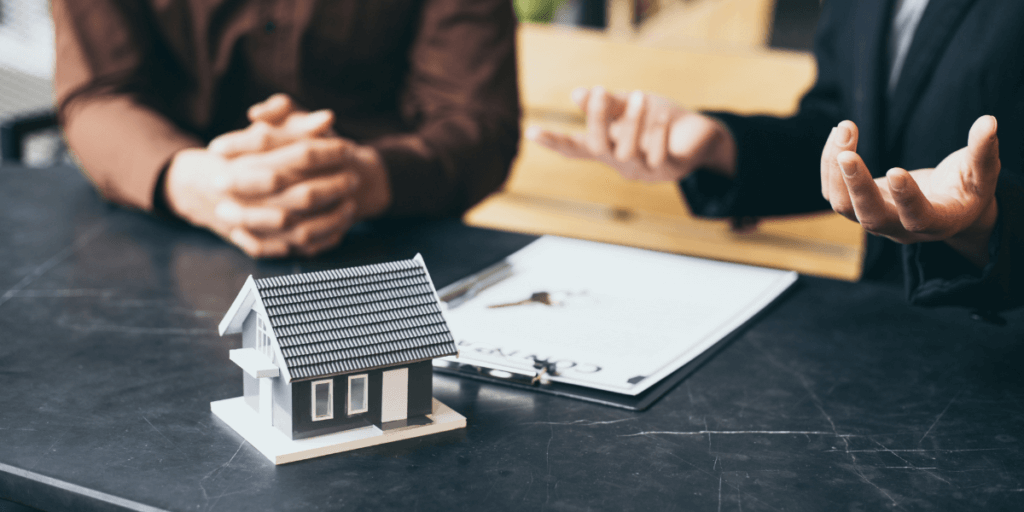 Man sitting with women discussing contract signing a lease | Rental Value